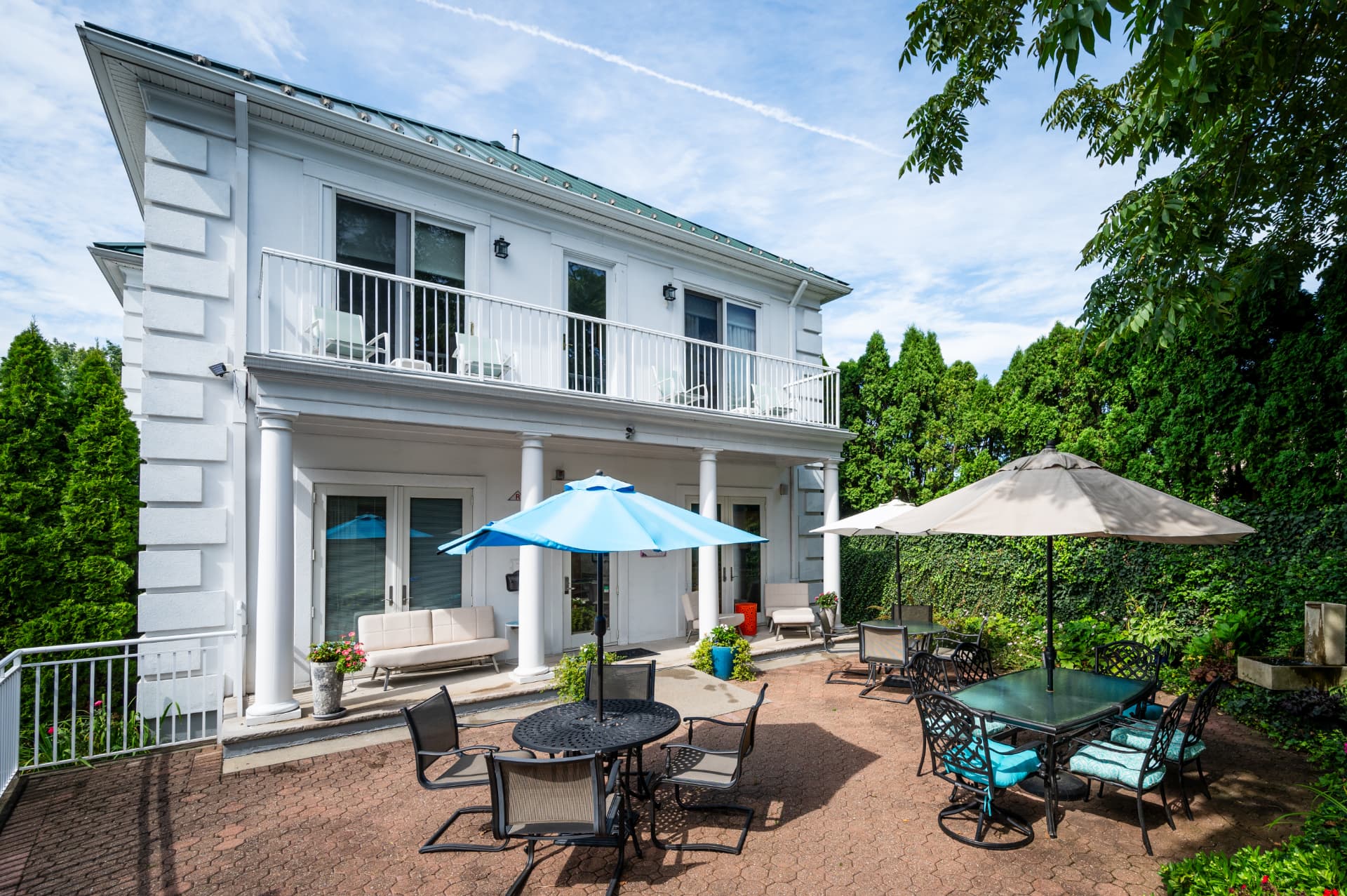 Outdoor patio and balcony at the rear of the building
