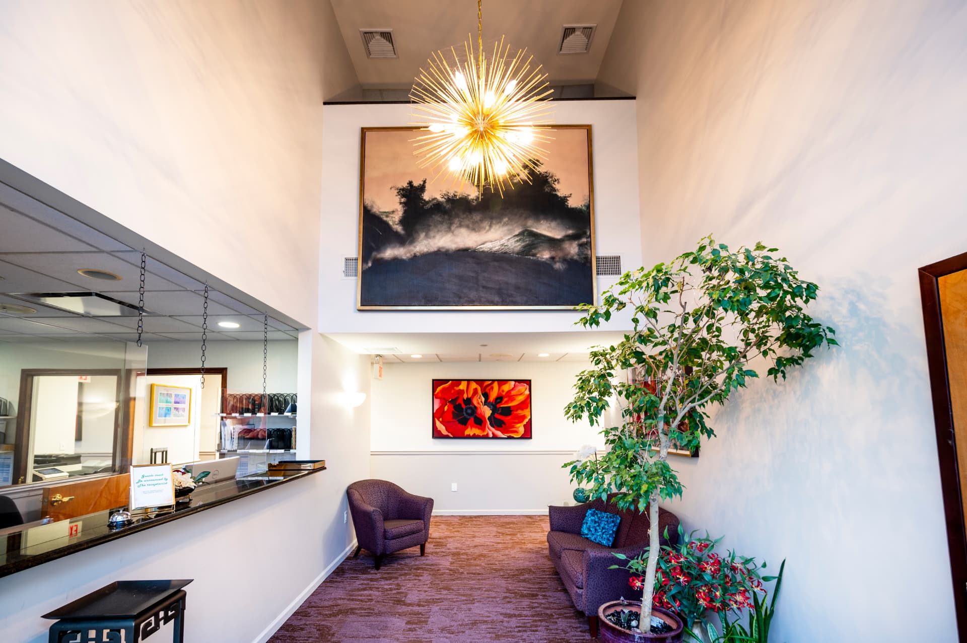 Reception lobby with chandelier and seating area
